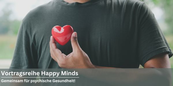 Mann mit Herz vor der Brust